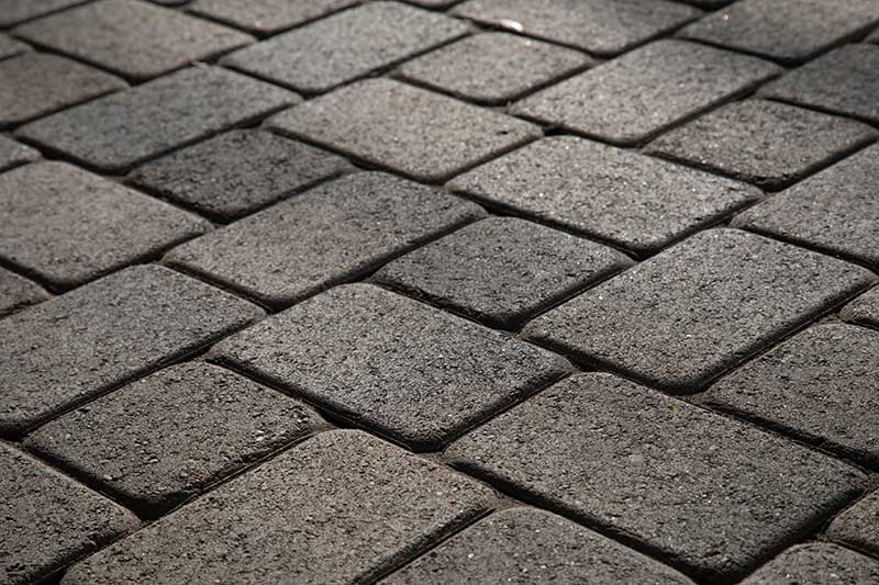 Smooth Pavers Vs. Tumbled Pavers: Which One Is Right for Your Next Project?